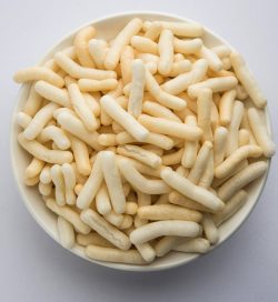 Puffed Rice or wheat or Corn snack also known as Fryums served over moody background